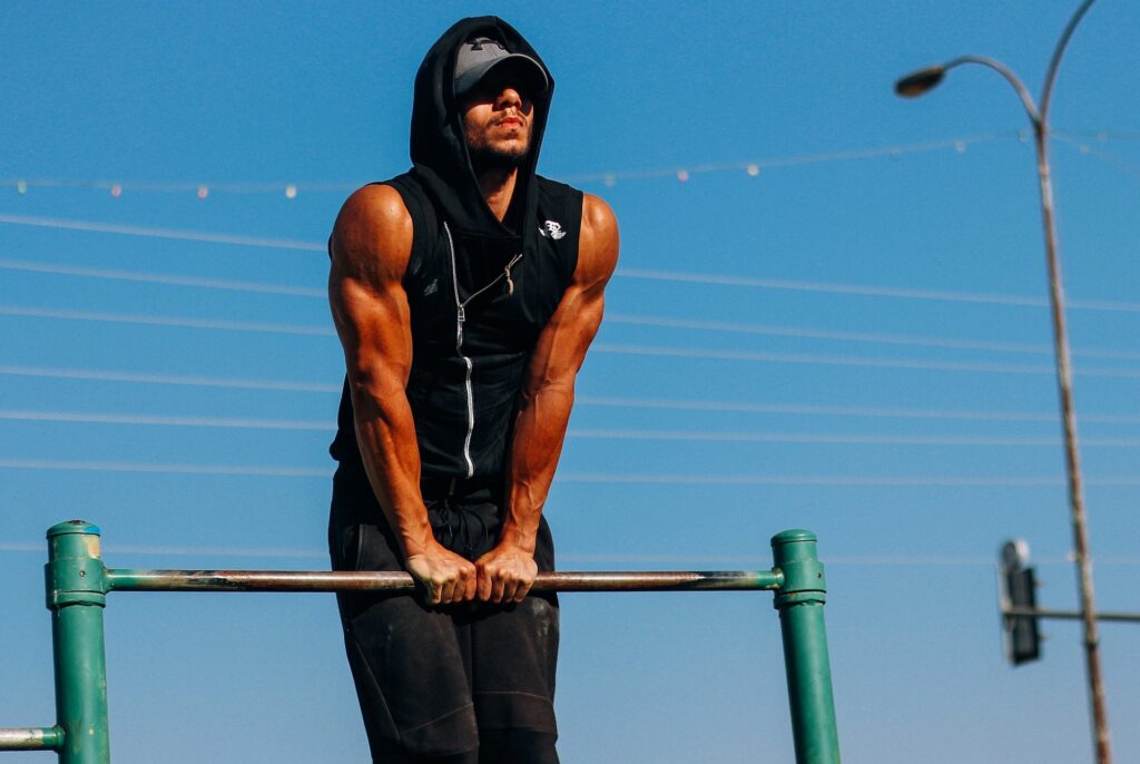 Person performing narrow-grip muscle-up.